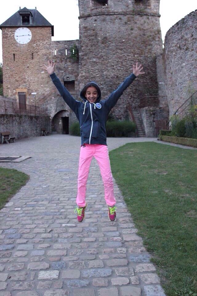 MAP² Explorers student celebrating at a historic castle site